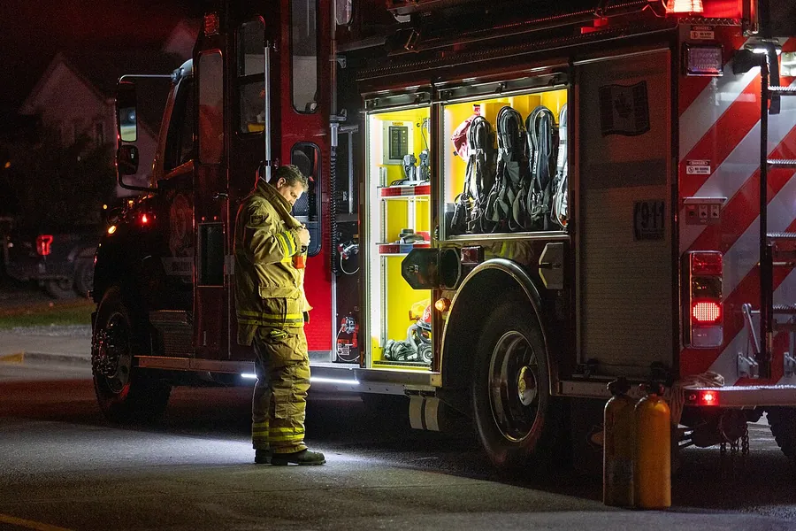 A District of Vanderhoof volunteer firefighter alongside Fire Engine 12 responding to a working fire on…