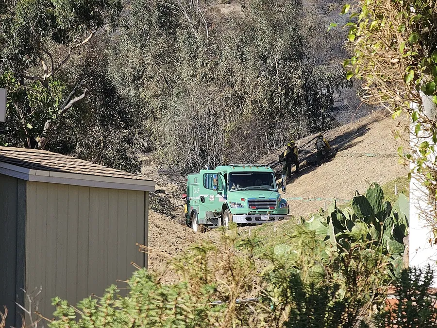 US Forest Service Fire Engine after the Hurst Fire from Oakridge. Firefighters are seen ascending the…